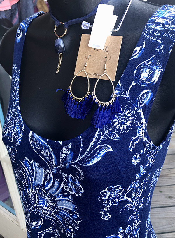 purple blouse and matching earrings